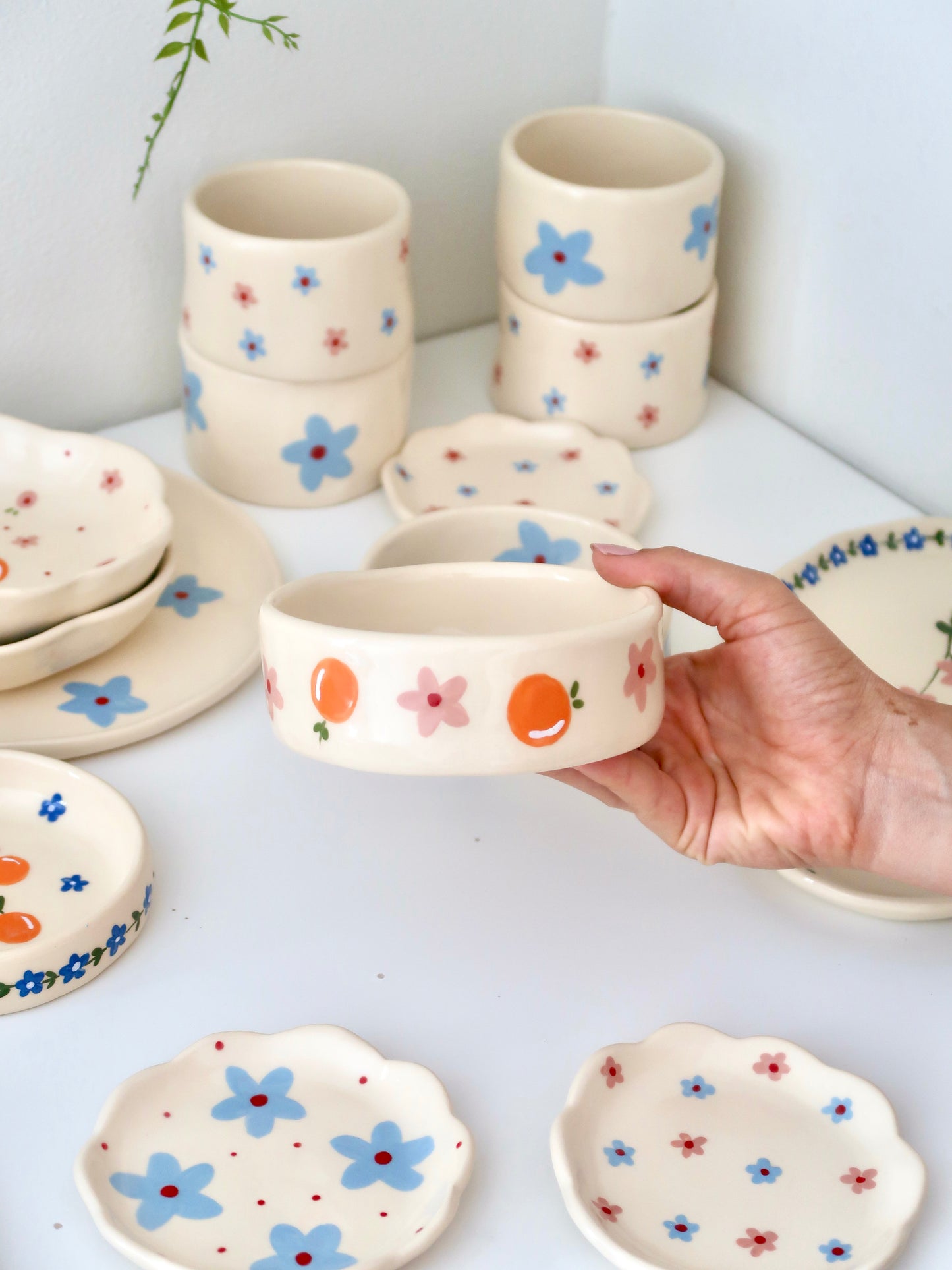 Bowl with oranges and blue flowers