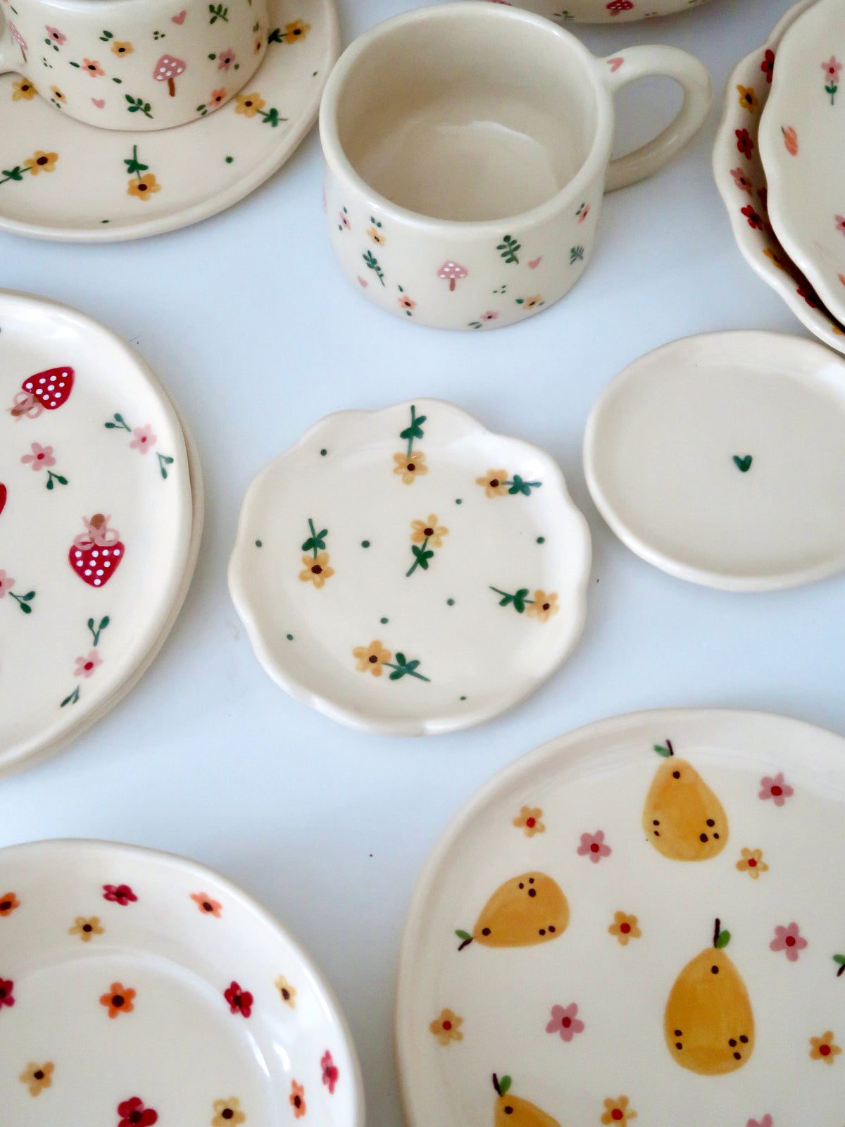 Scalloped ring dish with yellow flowers and green dots