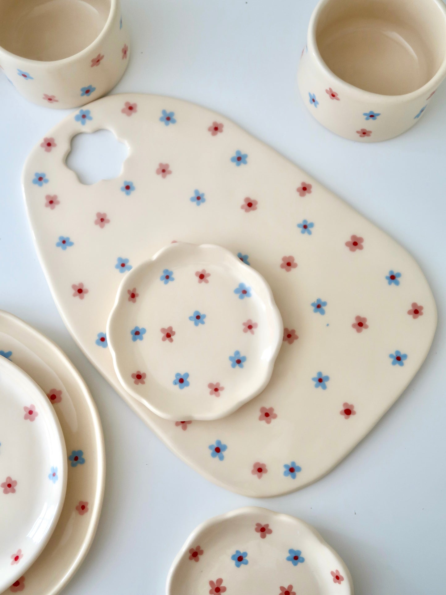 Scalloped ring dish with pink and blue flowers