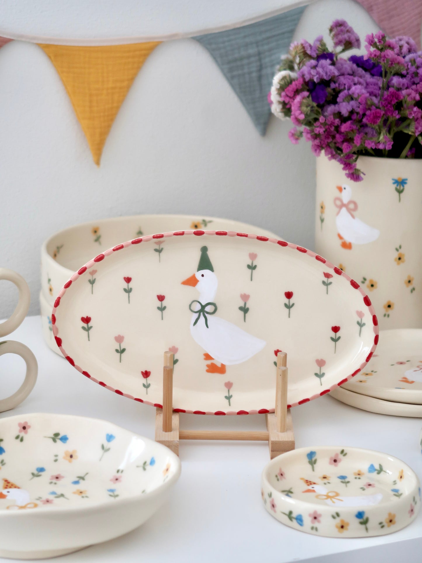 Platter with a duck, red and pink flowers