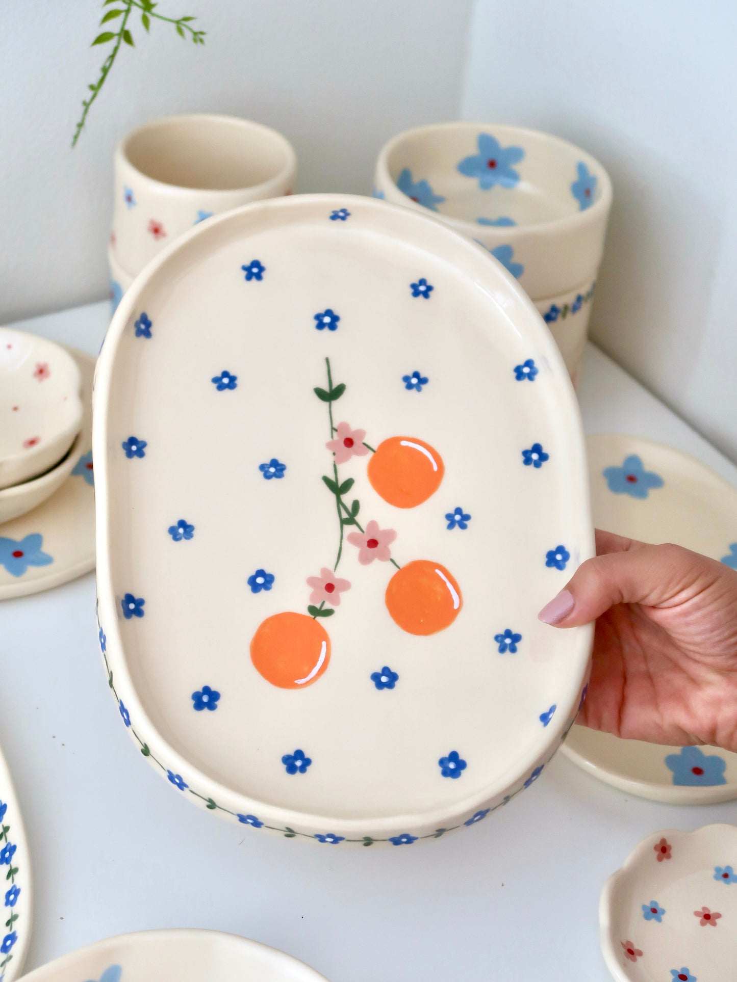Platter with oranges and pink flowers