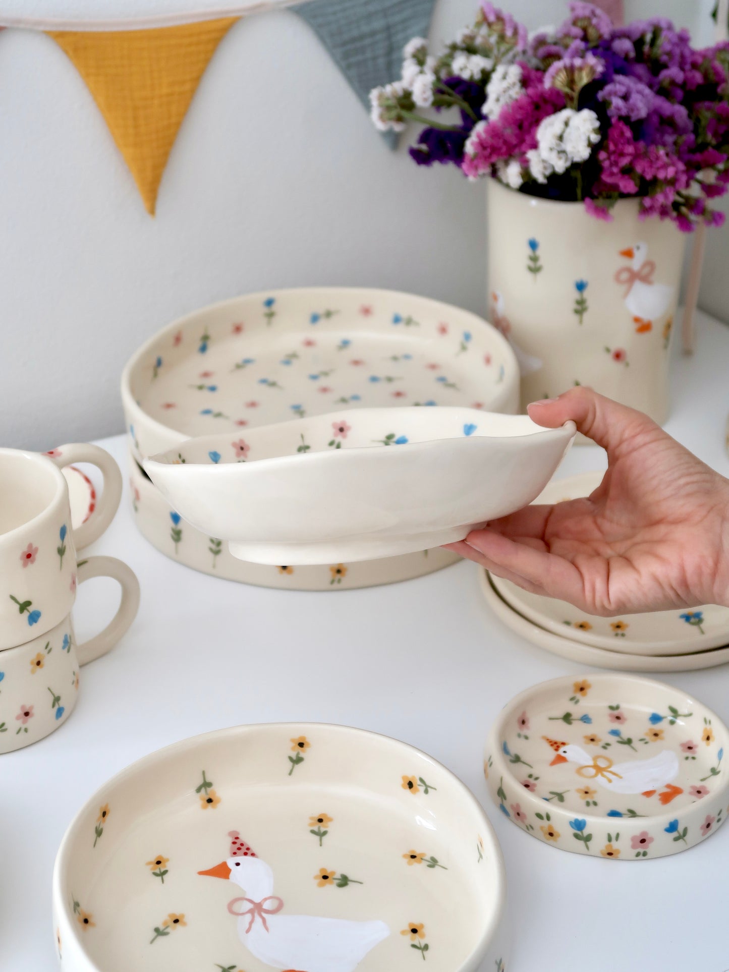 Bowl with a duck and multicolor flowers