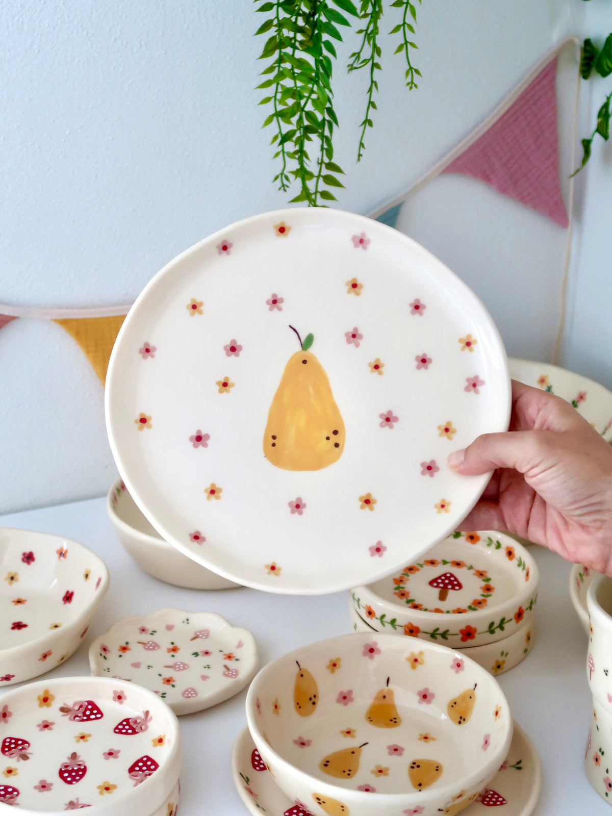 Plate with a pear, yellow and pink flowers