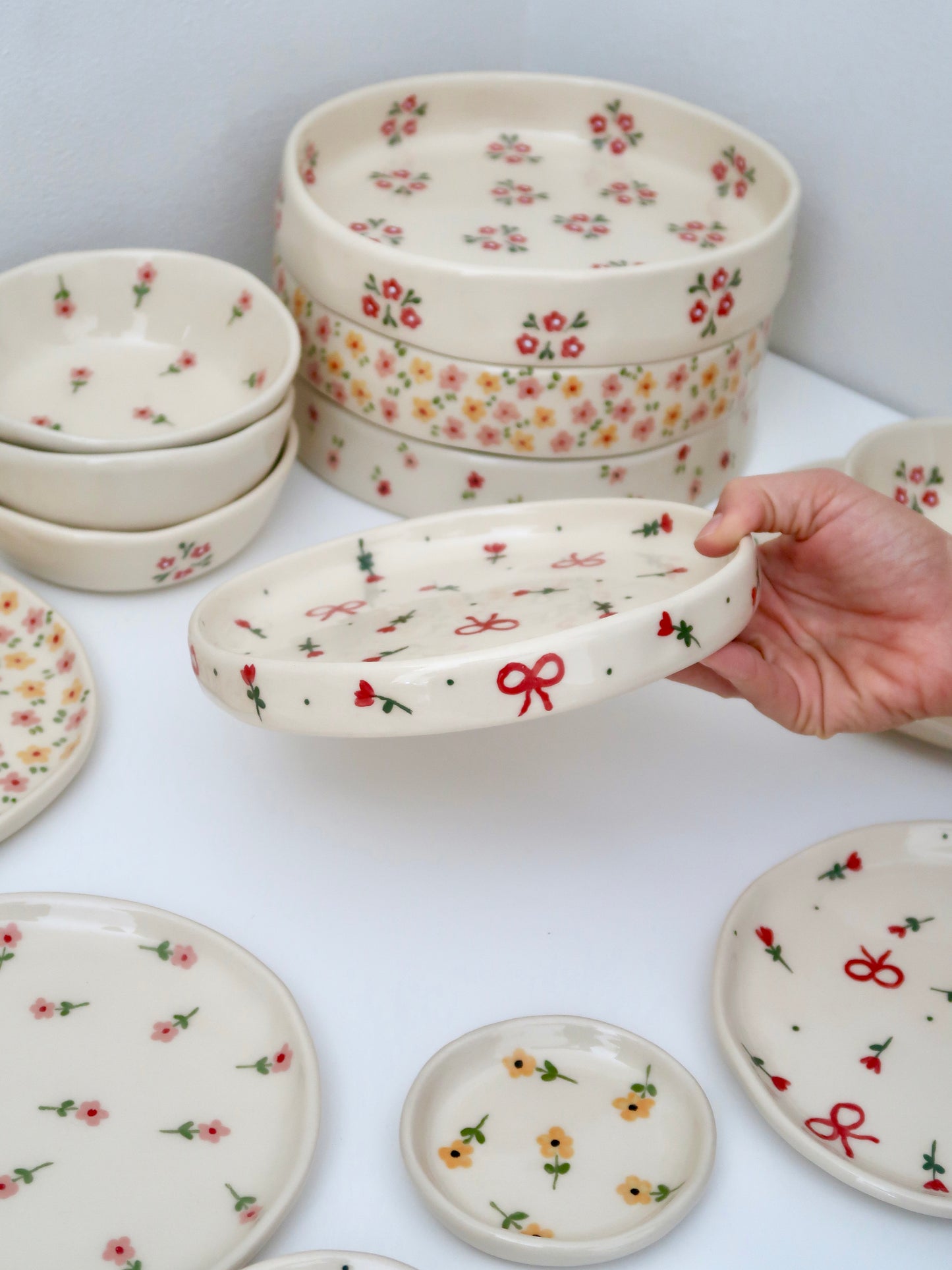 High edge plate with red flowers and bows