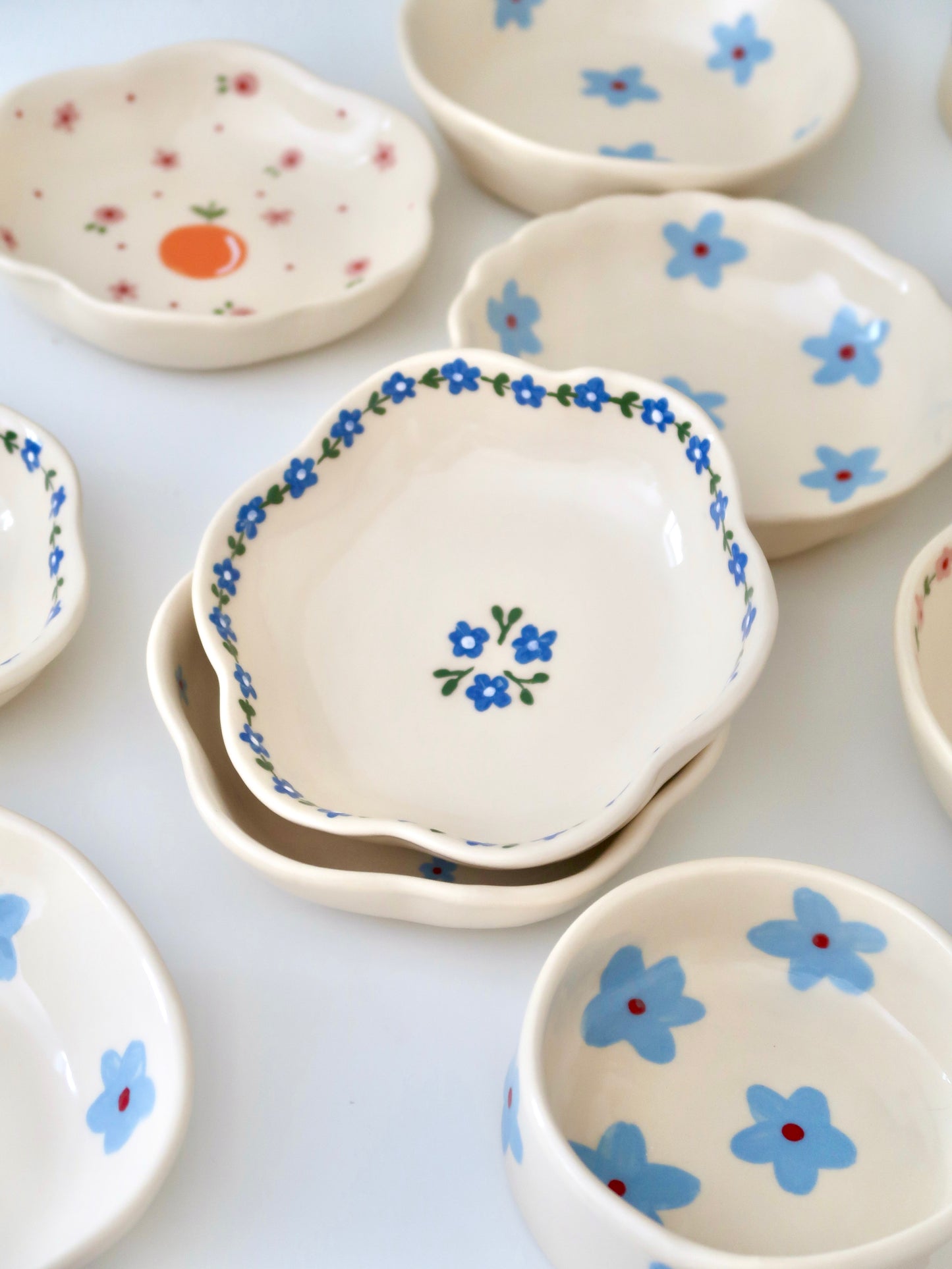 Scalloped bowl with blue flowers flowers