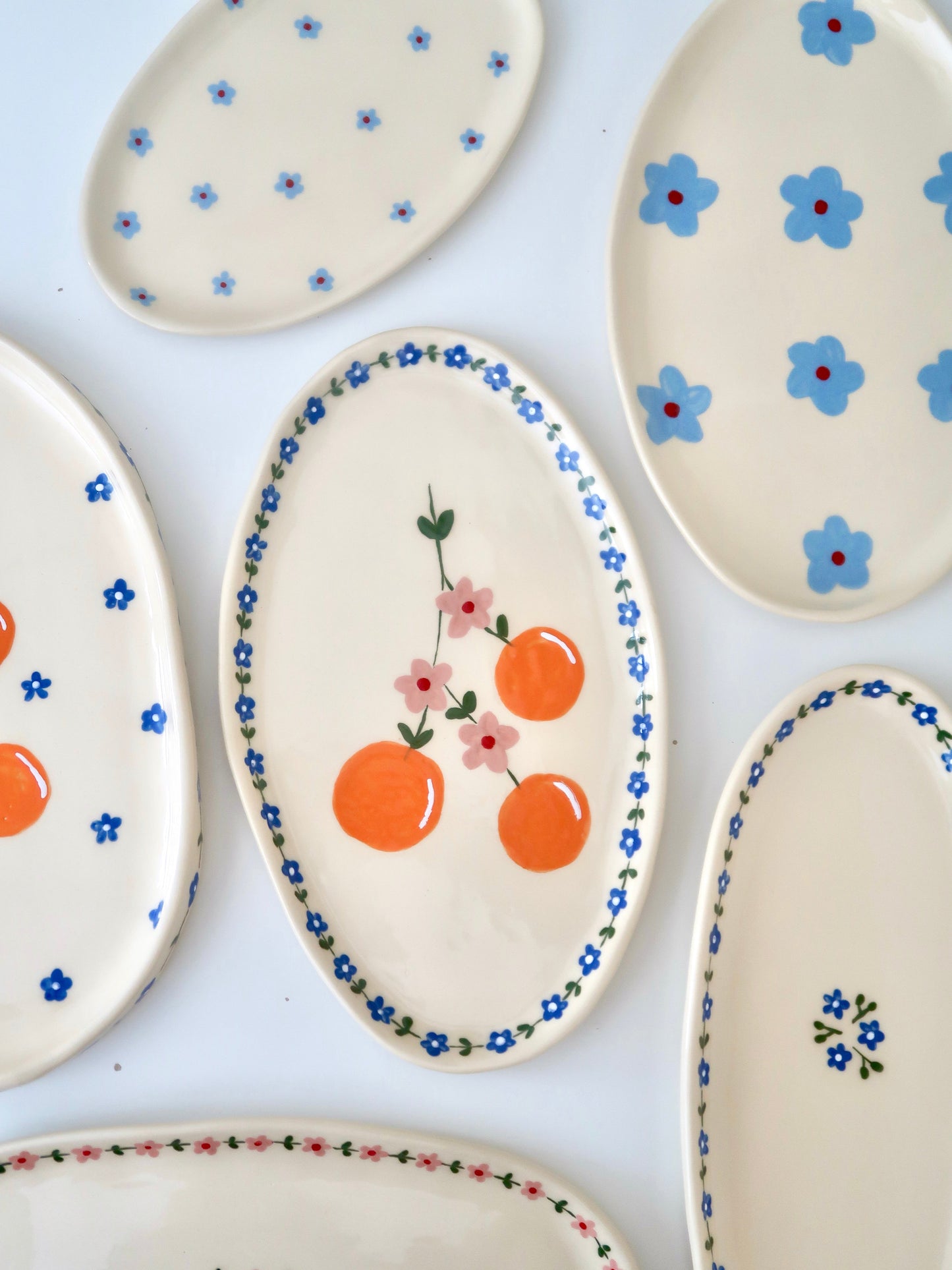 Platter with oranges and blue flowers