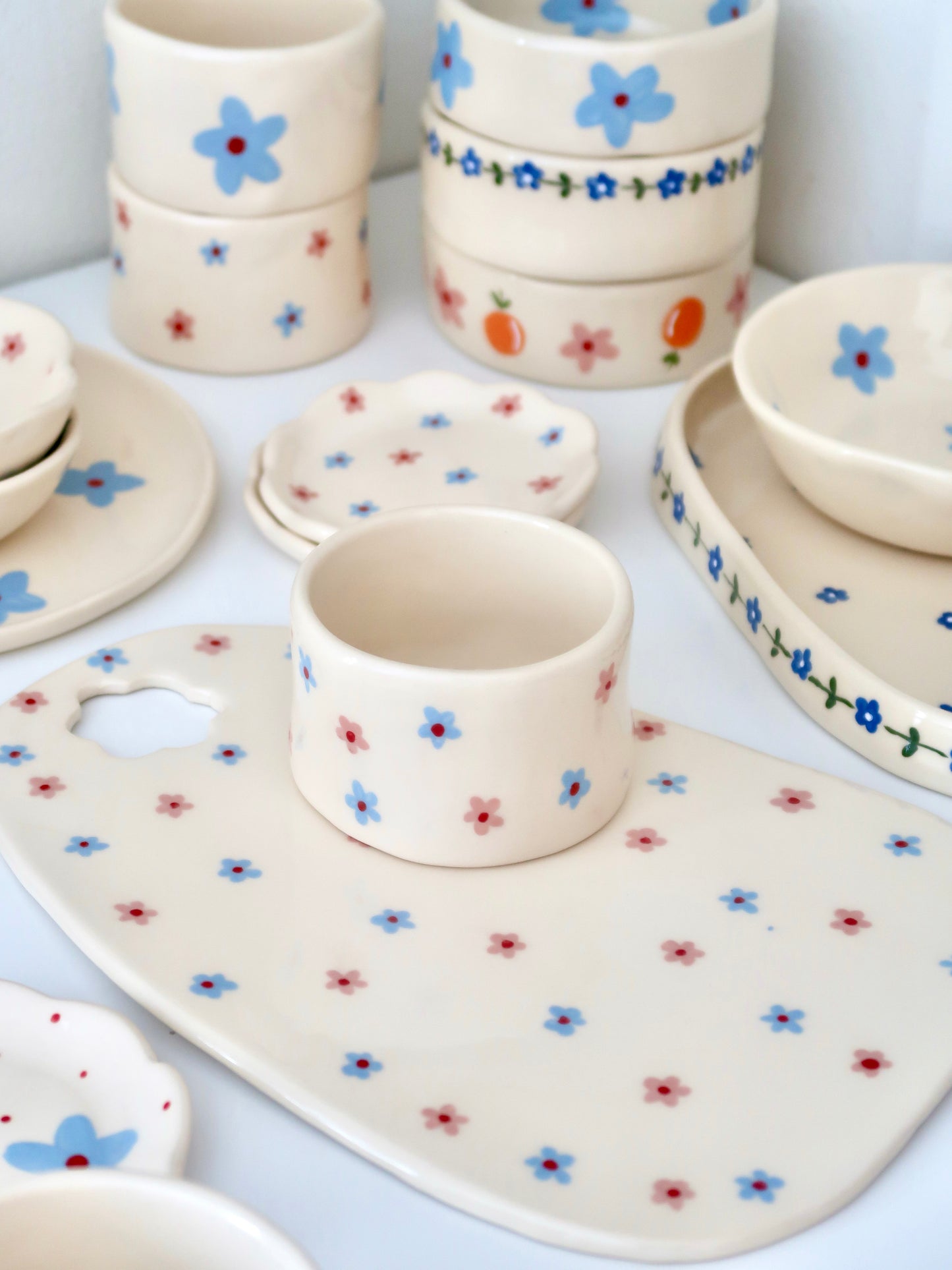 Small vase/ cup with pink and blue flowers