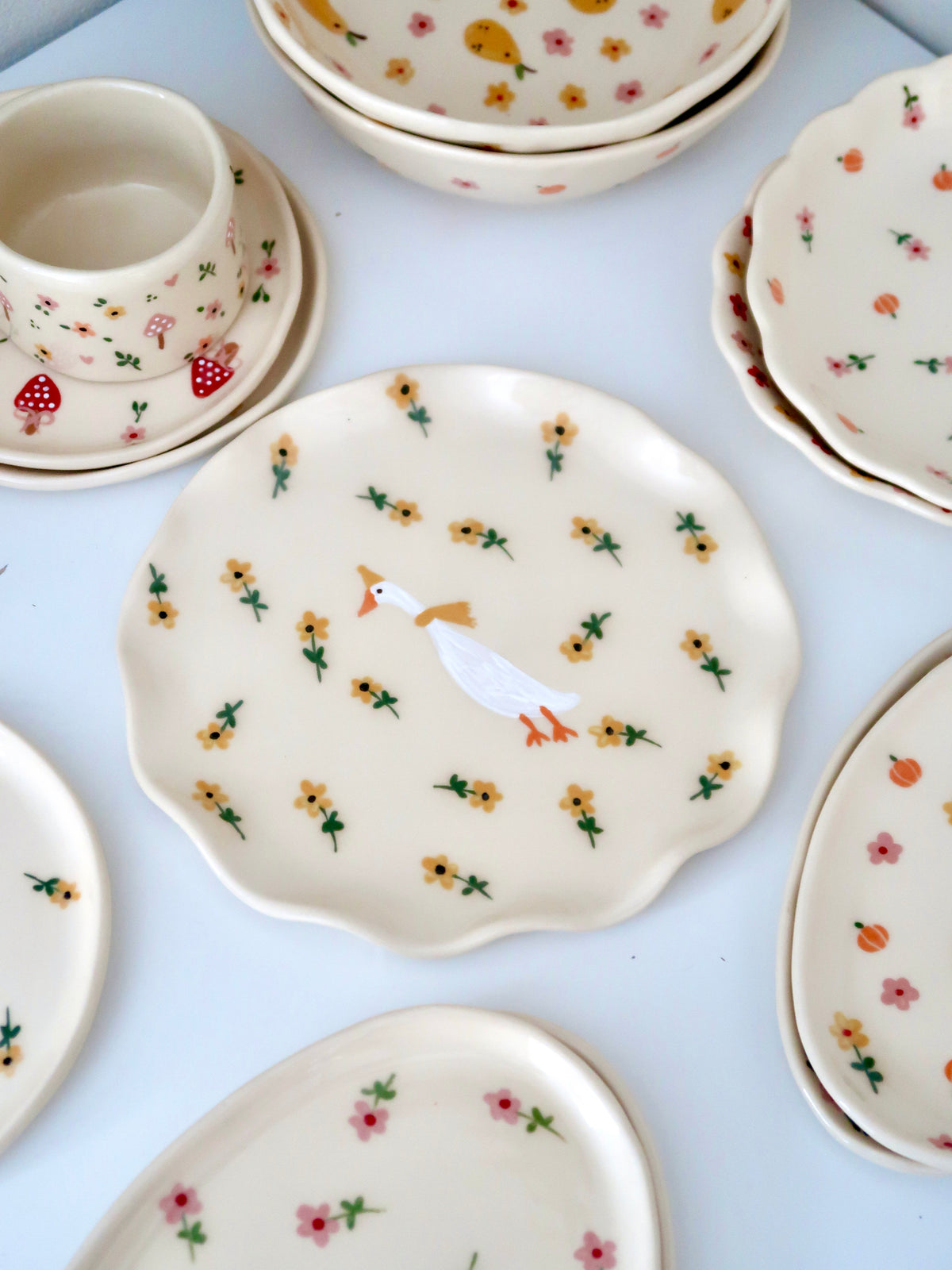 Wavy plate with a duck and yellow flowers