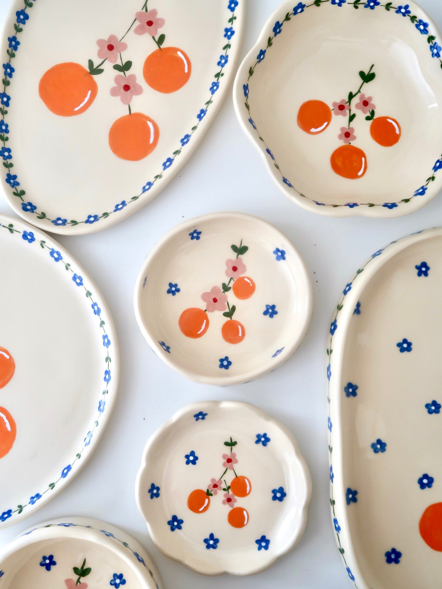 Ring dish with oranges and pink flowers