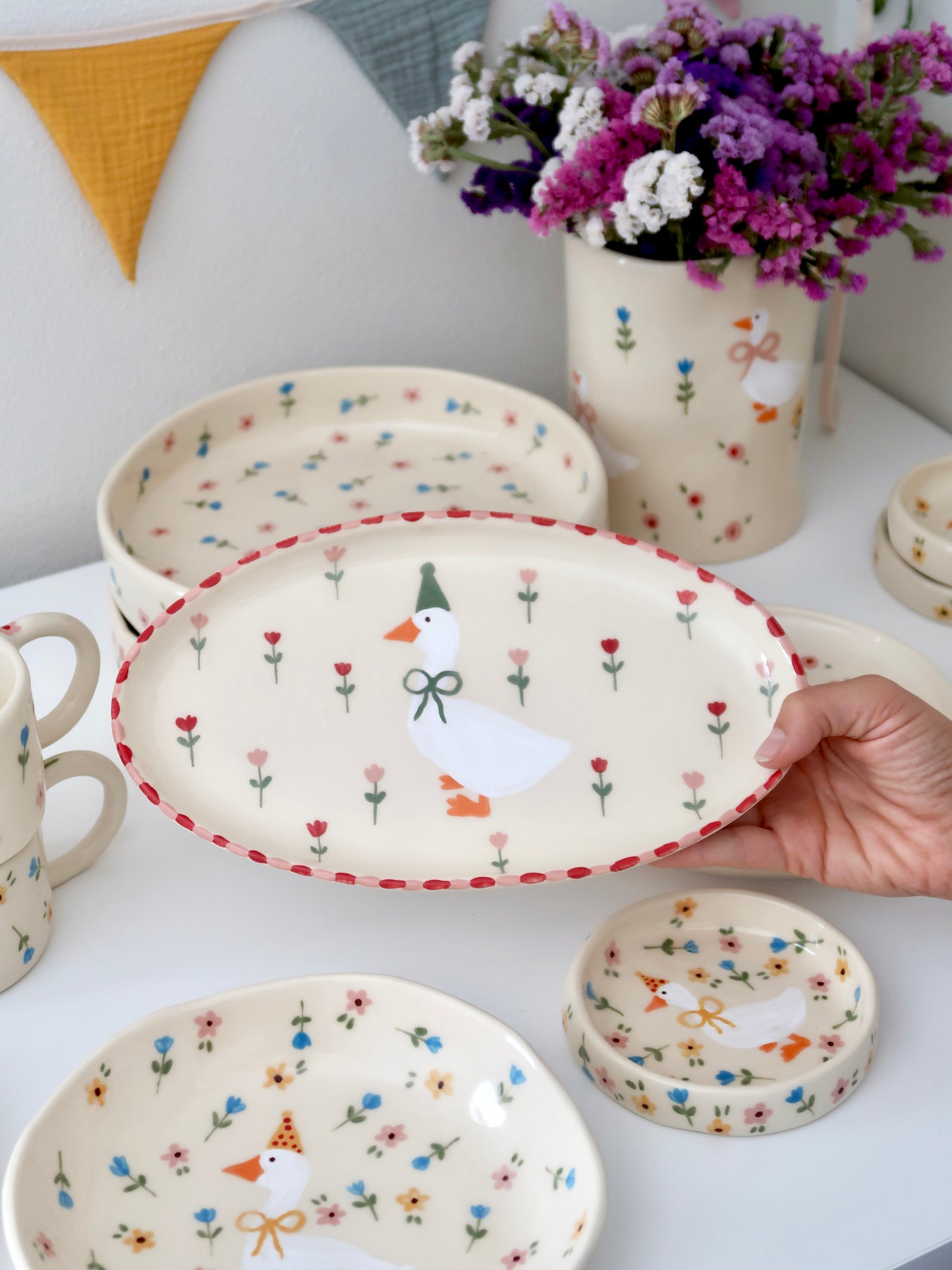 Platter with a duck, red and pink flowers