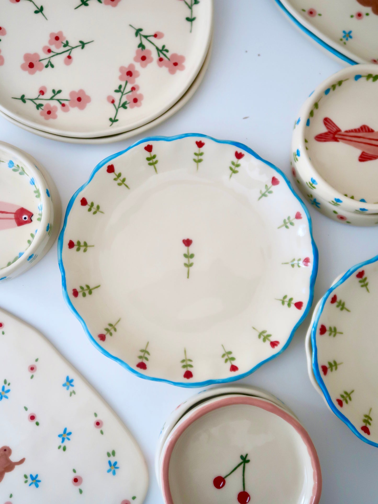 Scalloped plate with red flowers