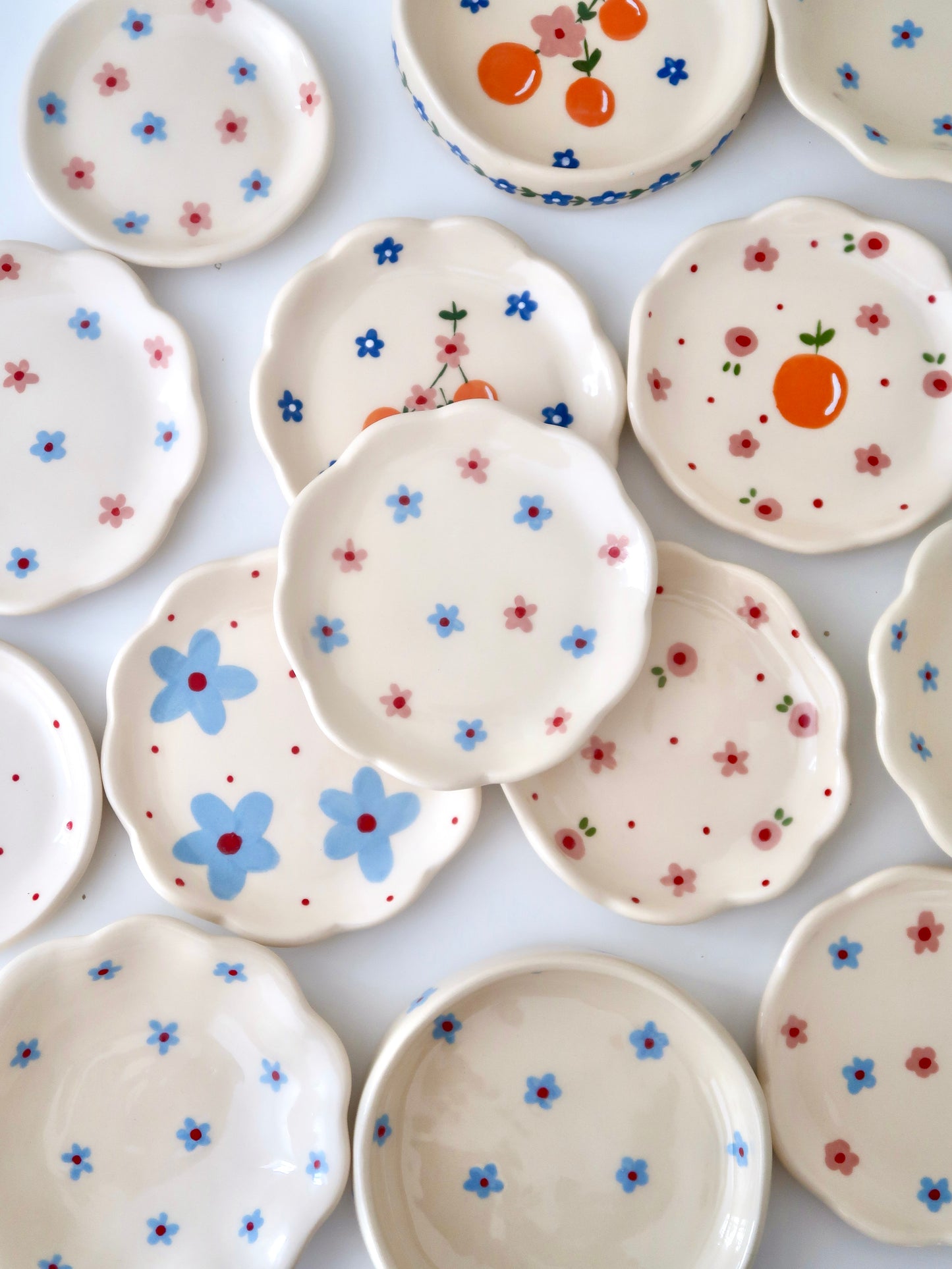 Scalloped ring dish with pink and blue flowers
