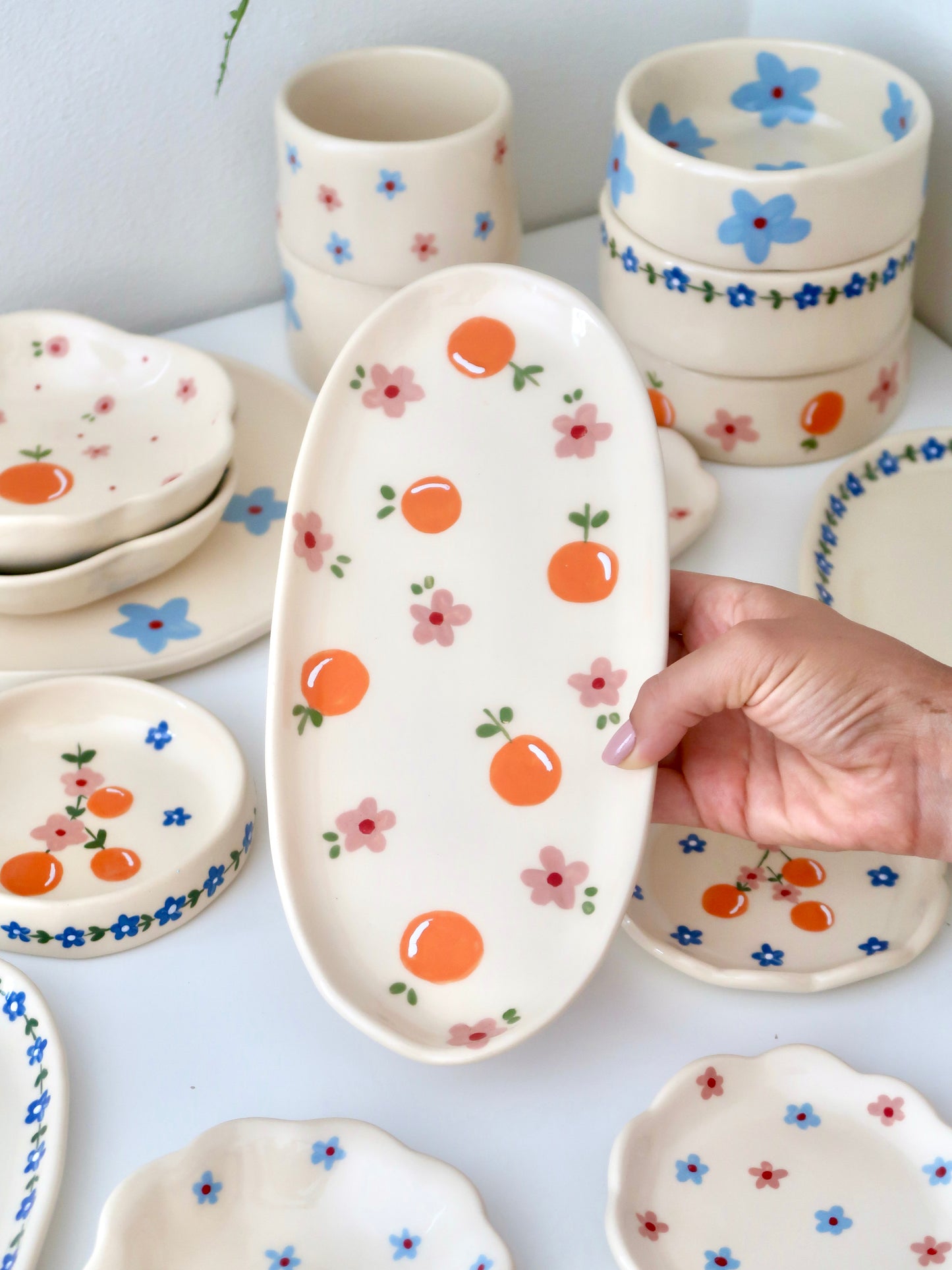 Platter with oranges and pink flowers