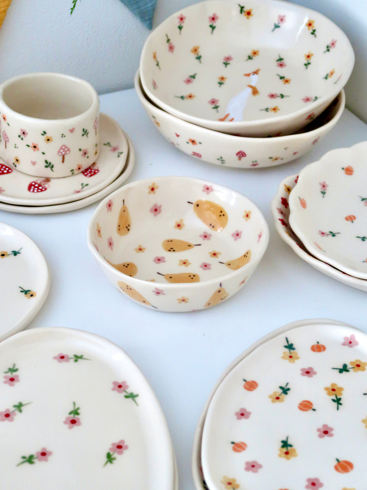 Bowl with pears, yellow and pink flowers