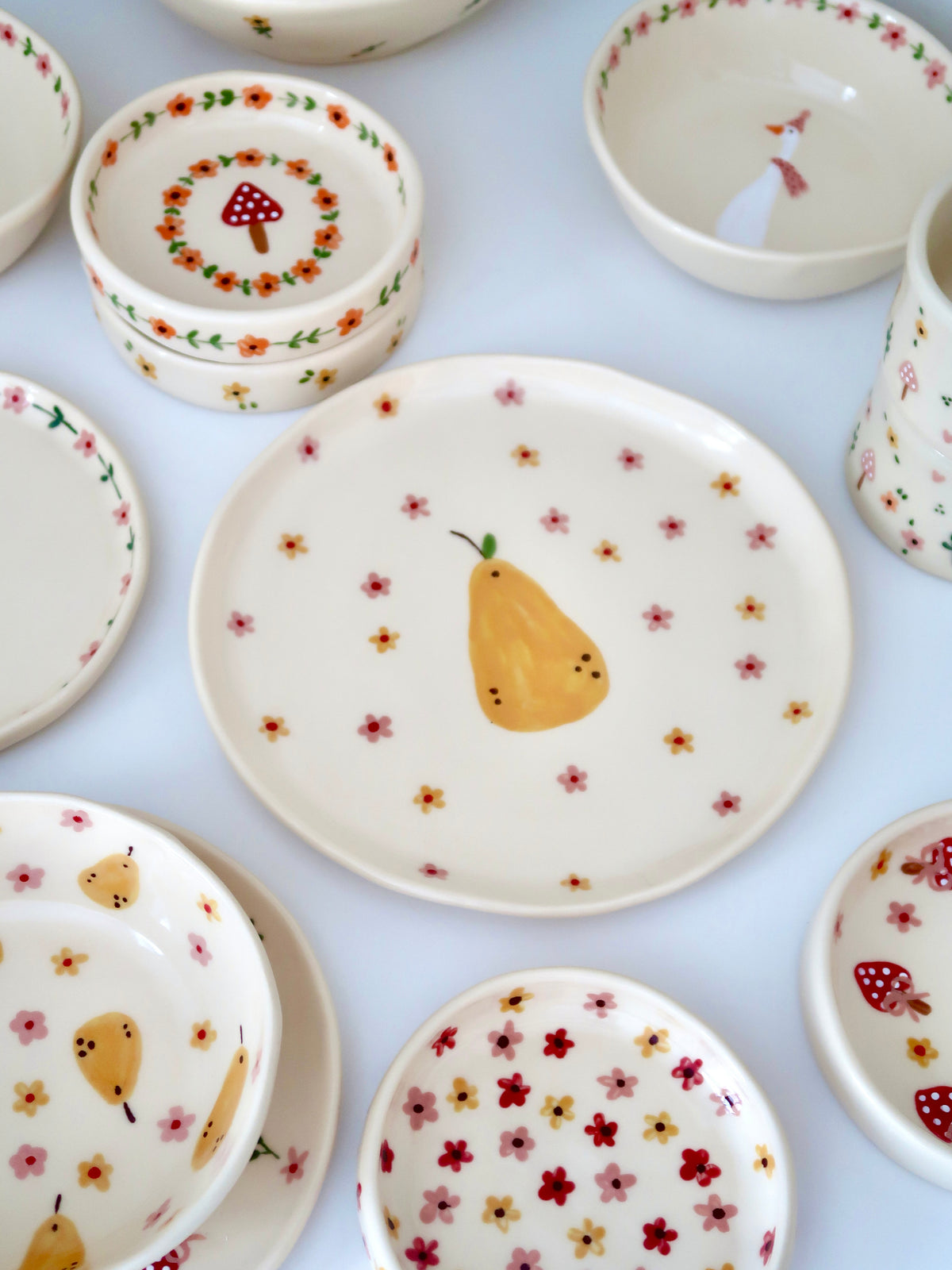 Plate with a pear, yellow and pink flowers