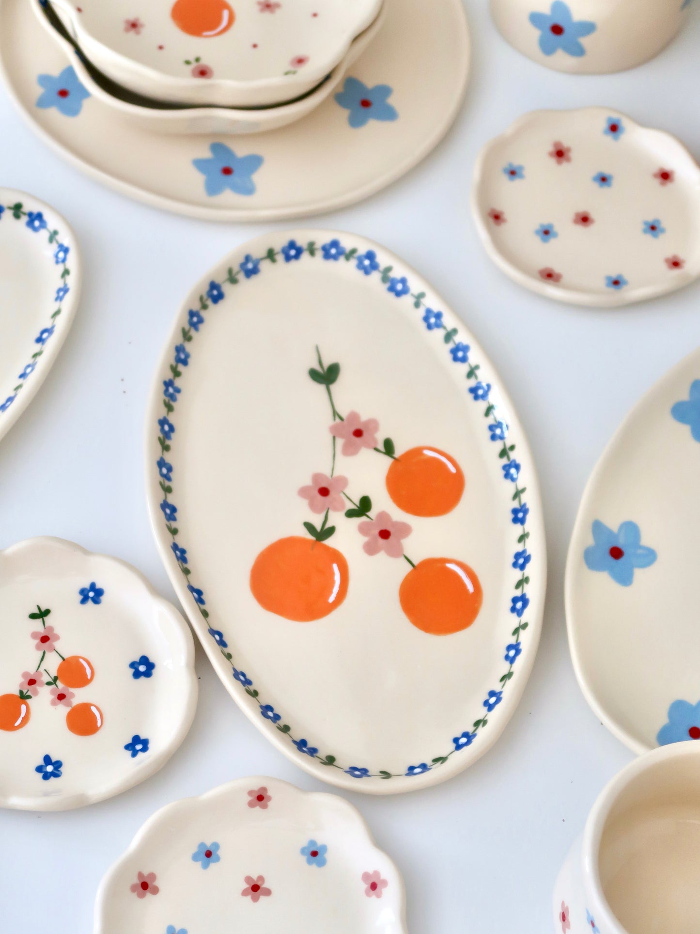 Platter with oranges and blue flowers