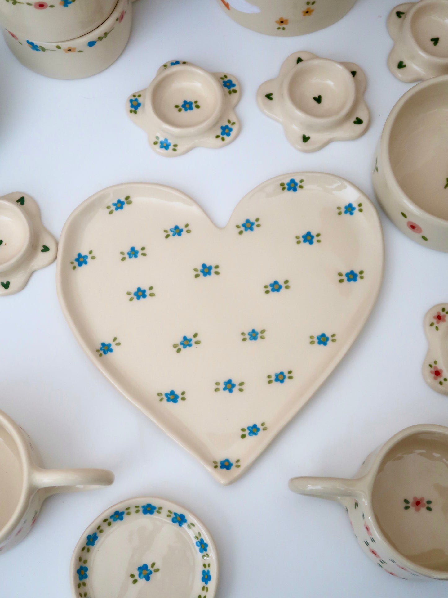 Large heart shaped plate with blue flowers (small imperfection)