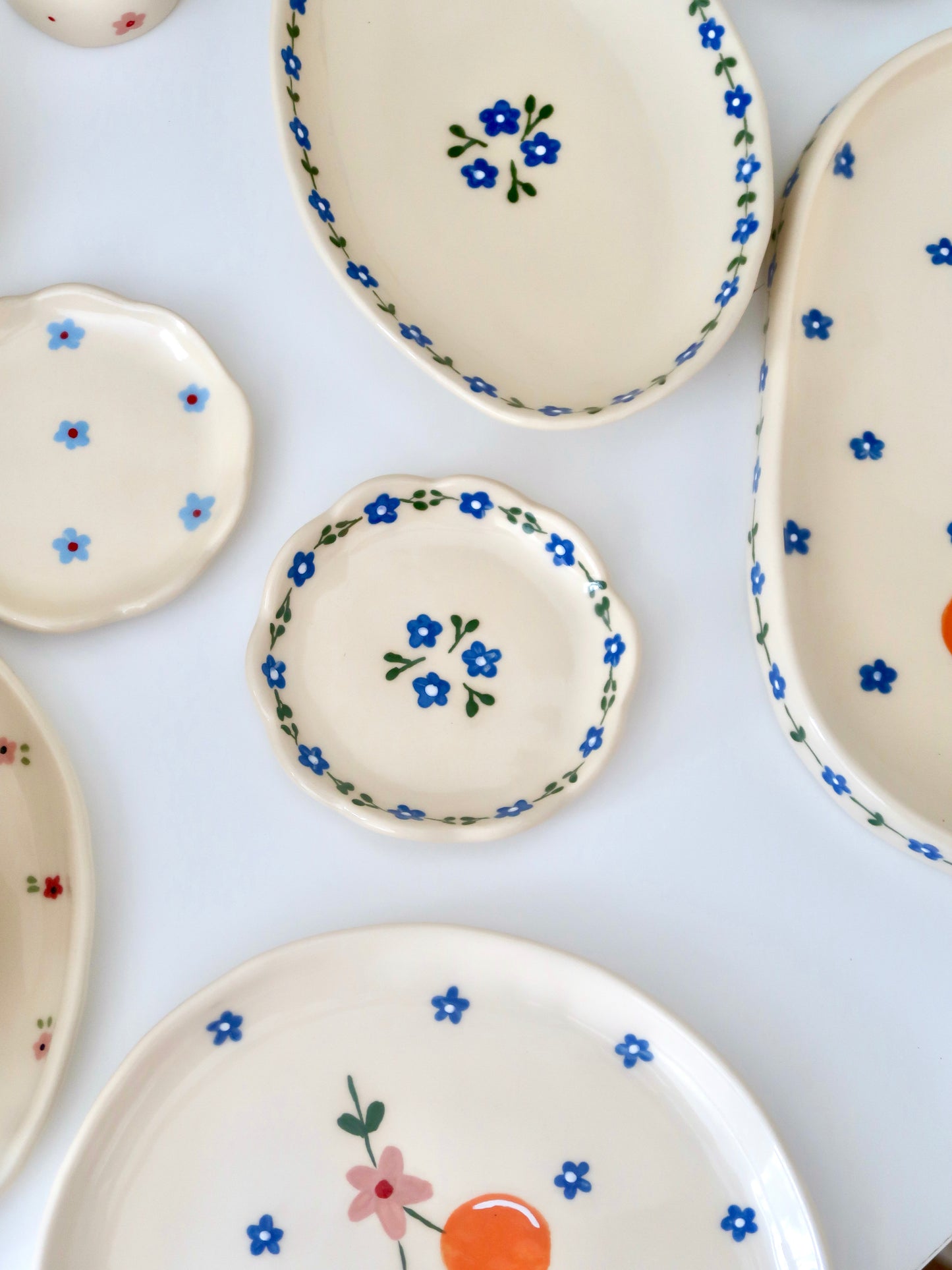 Scalloped ring dish with blue flowers