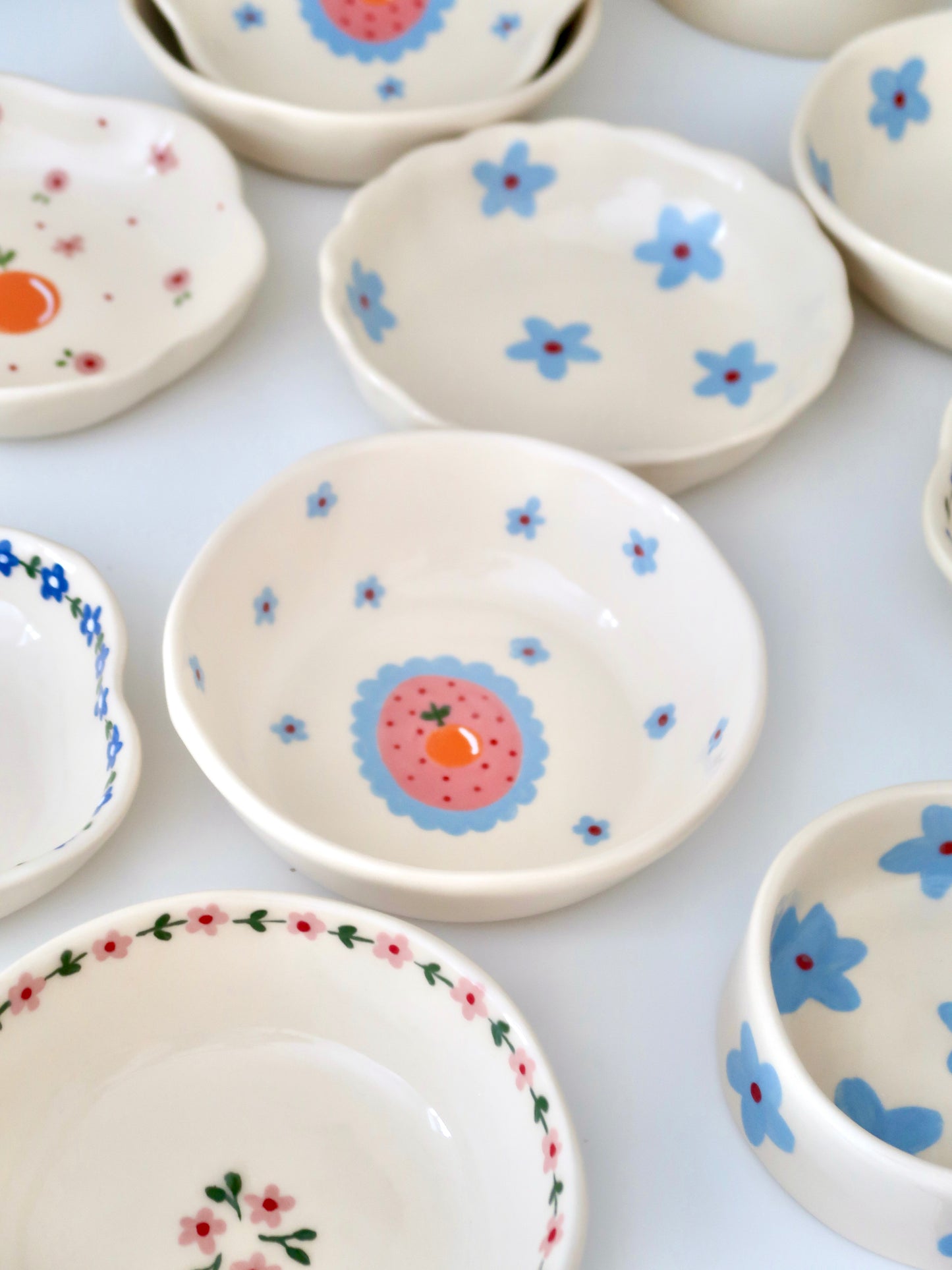 Bowl with orange and blue flowers
