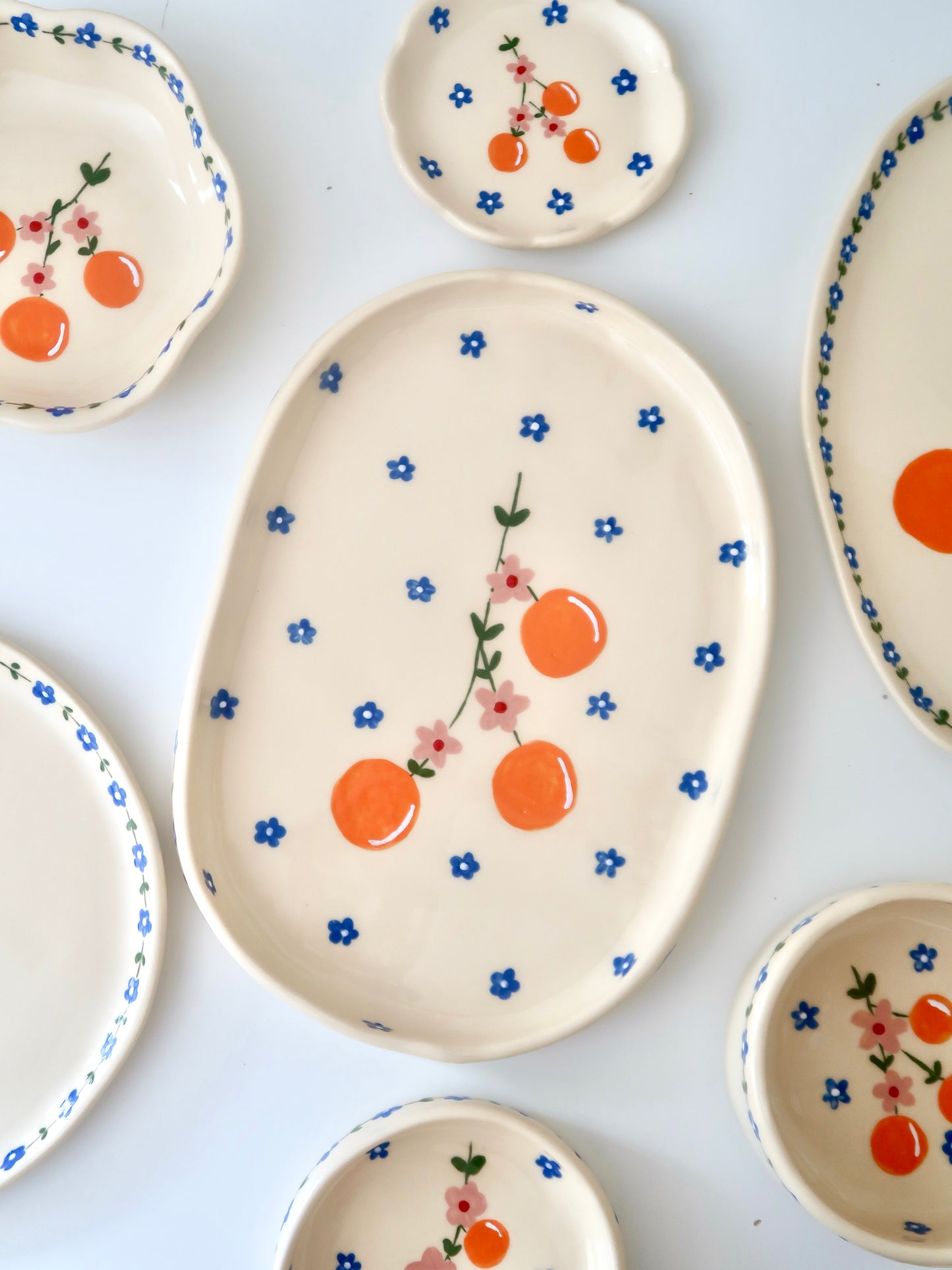Platter with oranges and pink flowers