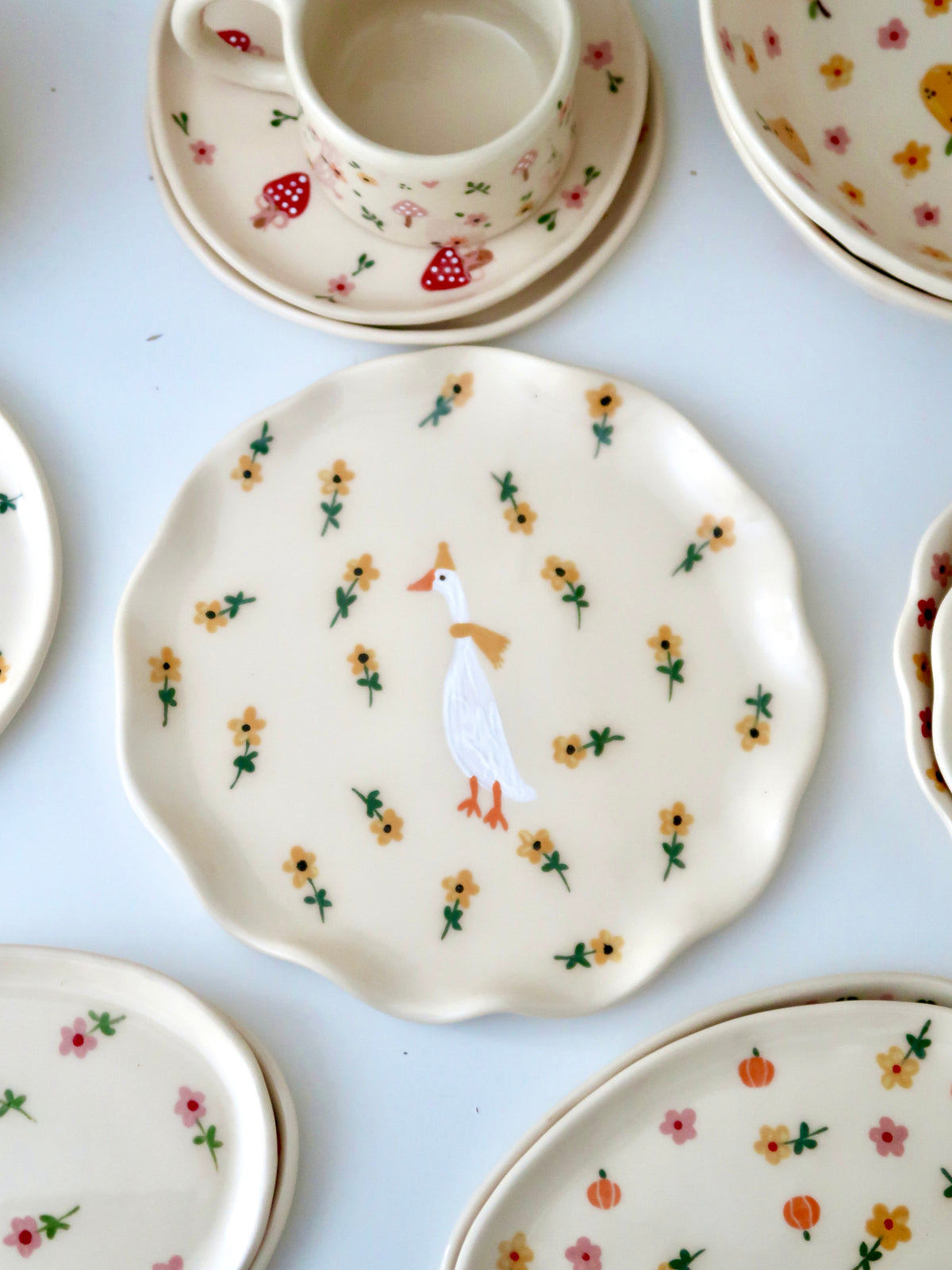 Wavy plate with a duck and yellow flowers