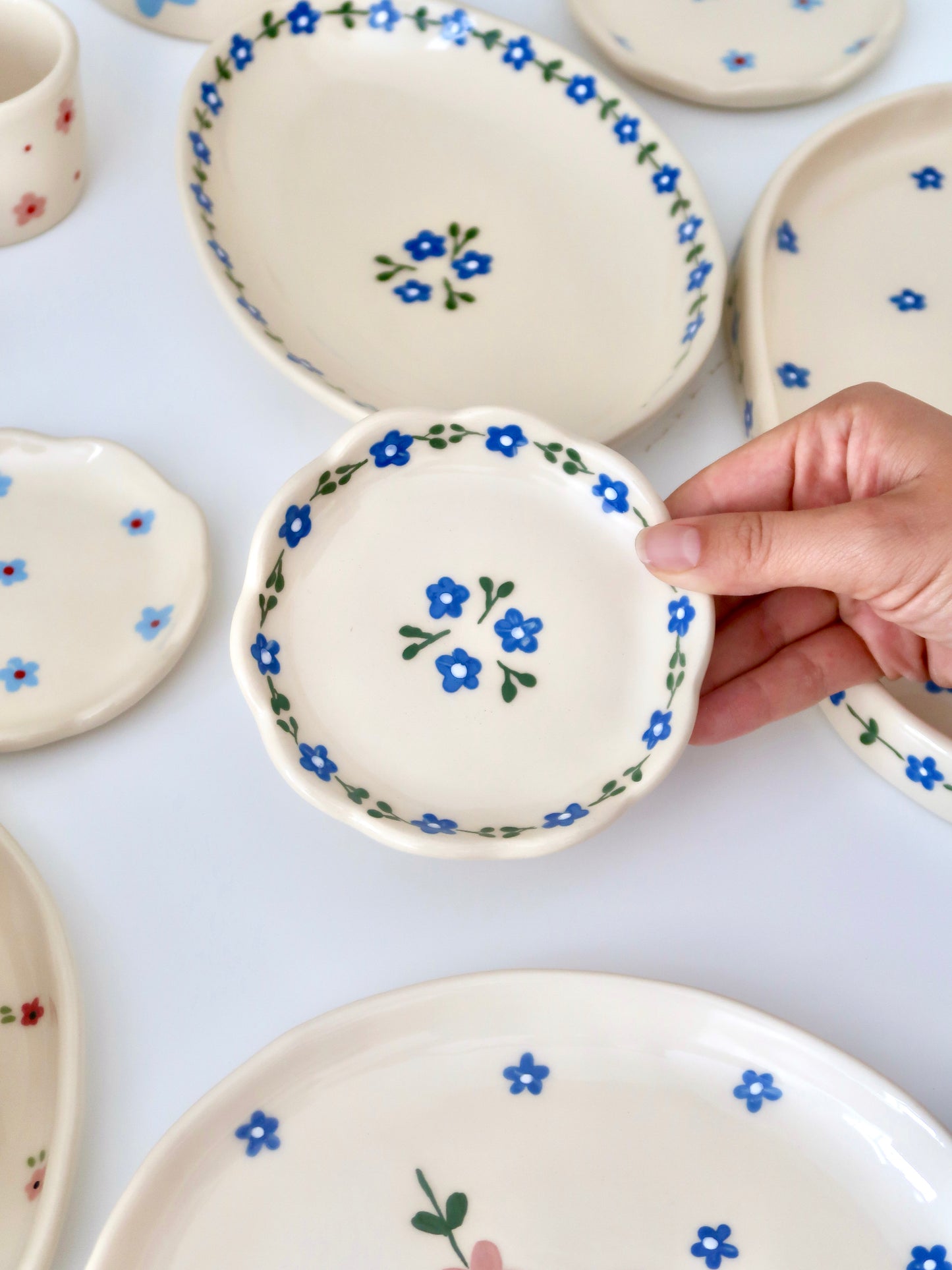 Scalloped ring dish with blue flowers