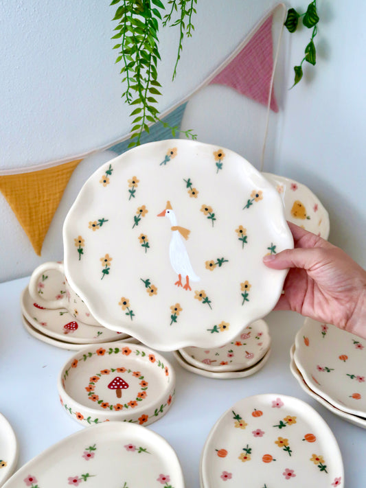 Wavy plate with a duck and yellow flowers