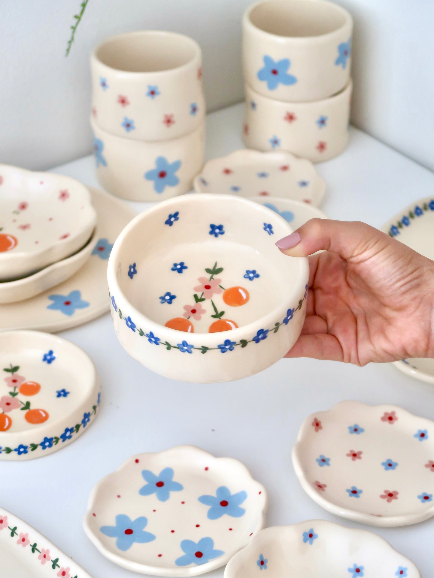 Bowl with oranges and pink flowers