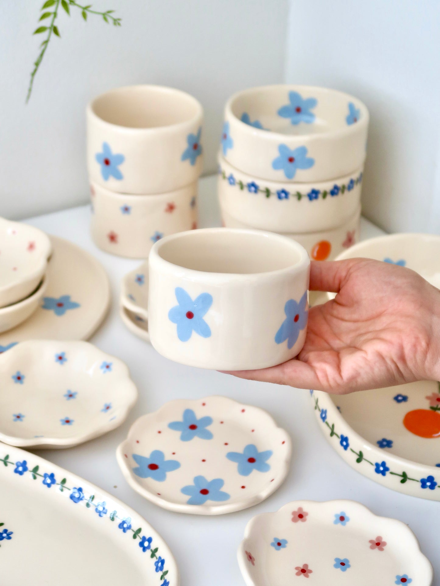 Small vase/ cup with blue flowers⁠
