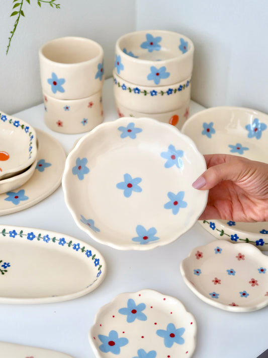 Scalloped bowl with blue flowers flowers
