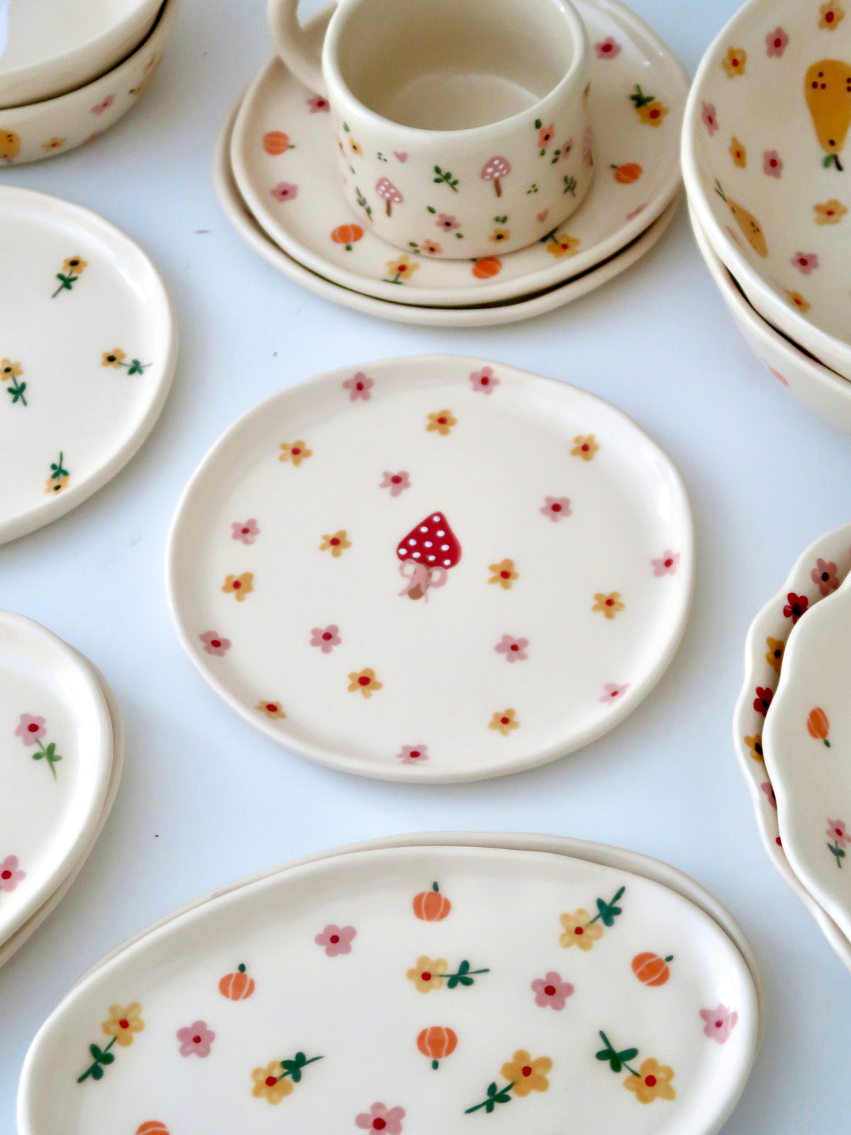 Breakfast/Dessert plate with a mushroom and pink and yellow flowers