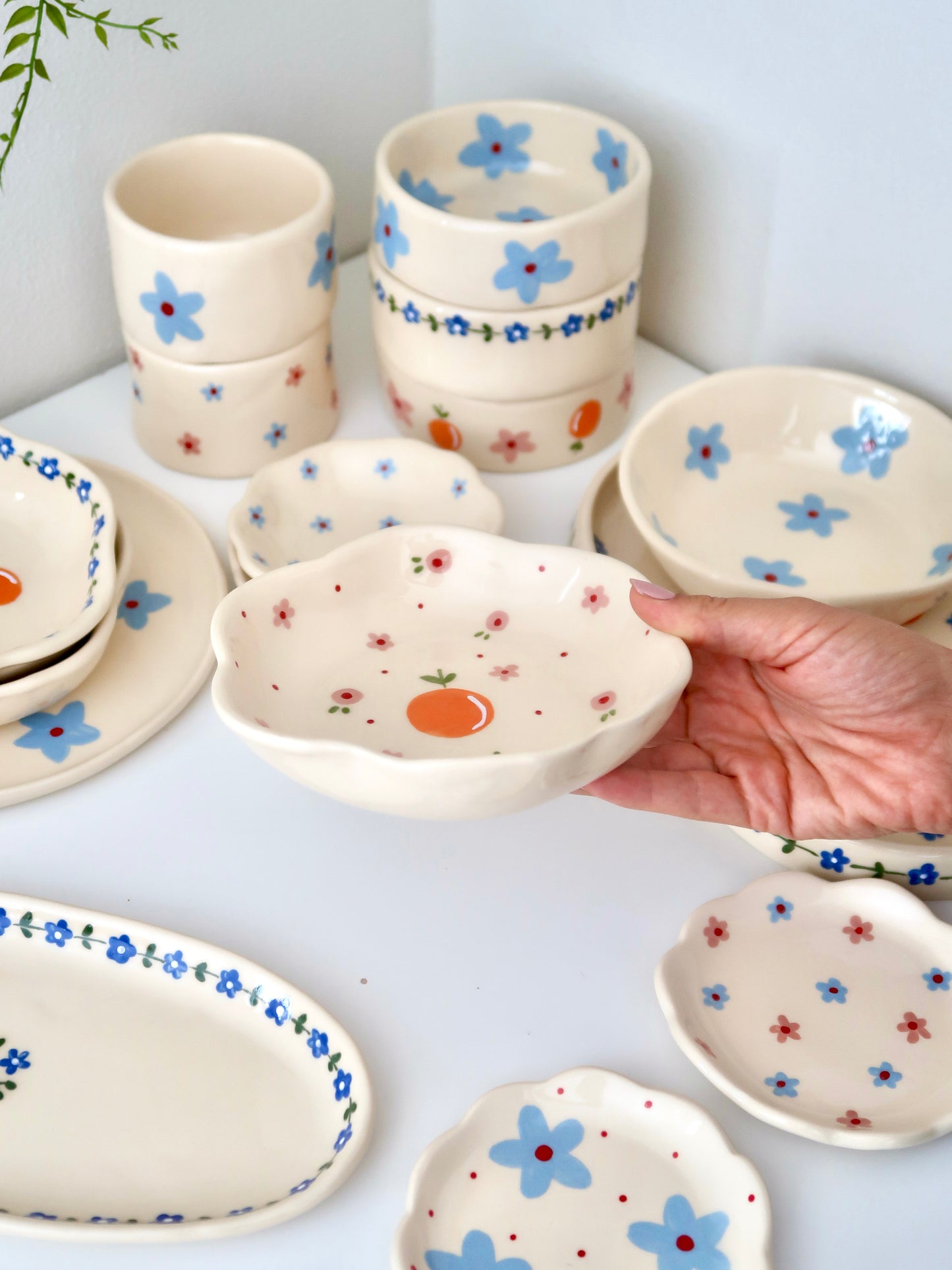 Scalloped bowl with orange and pink flowers