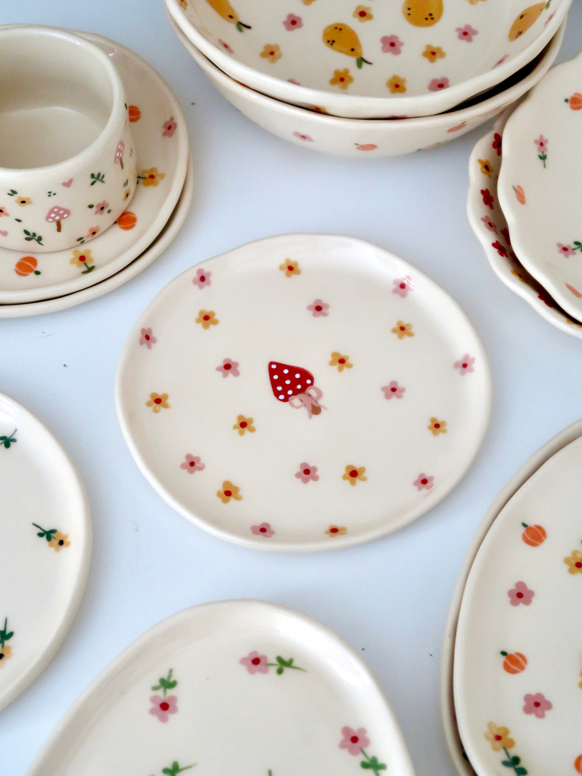 Breakfast/Dessert plate with a mushroom and pink and yellow flowers