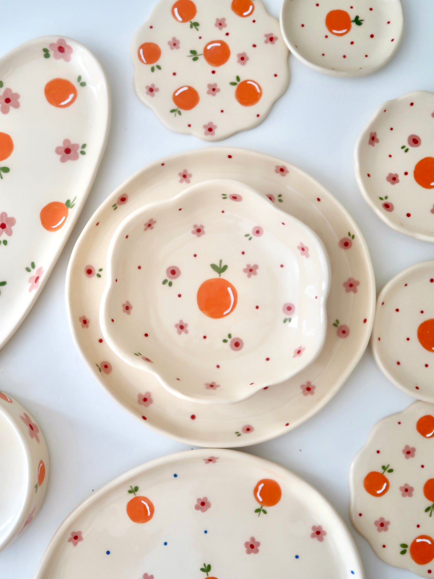 Scalloped bowl with orange and pink flowers