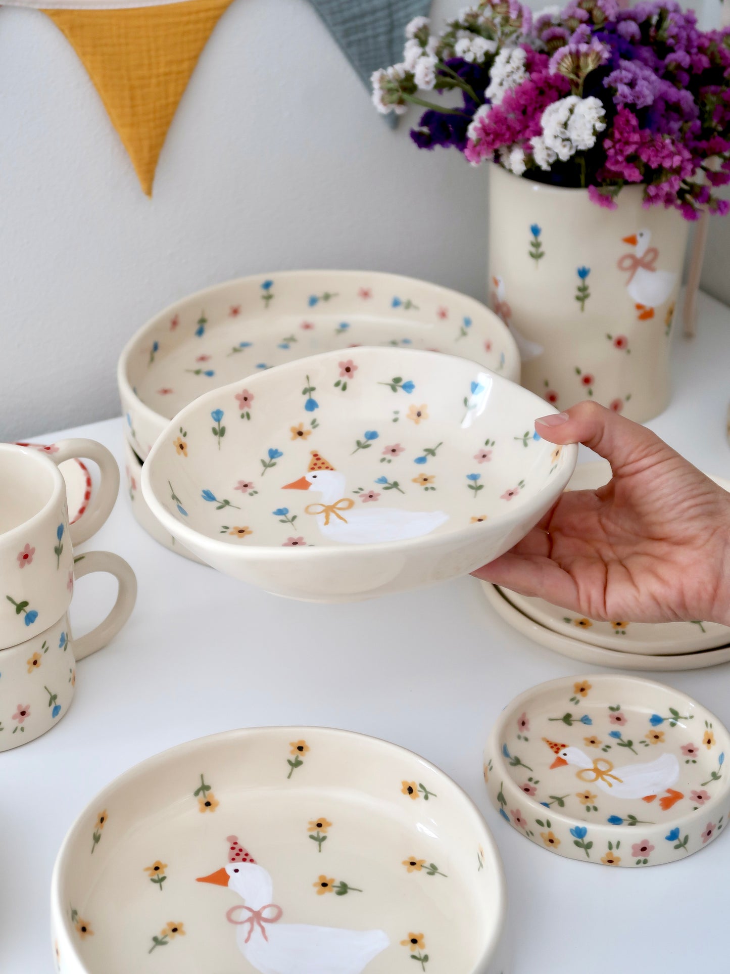 Bowl with a duck and multicolor flowers