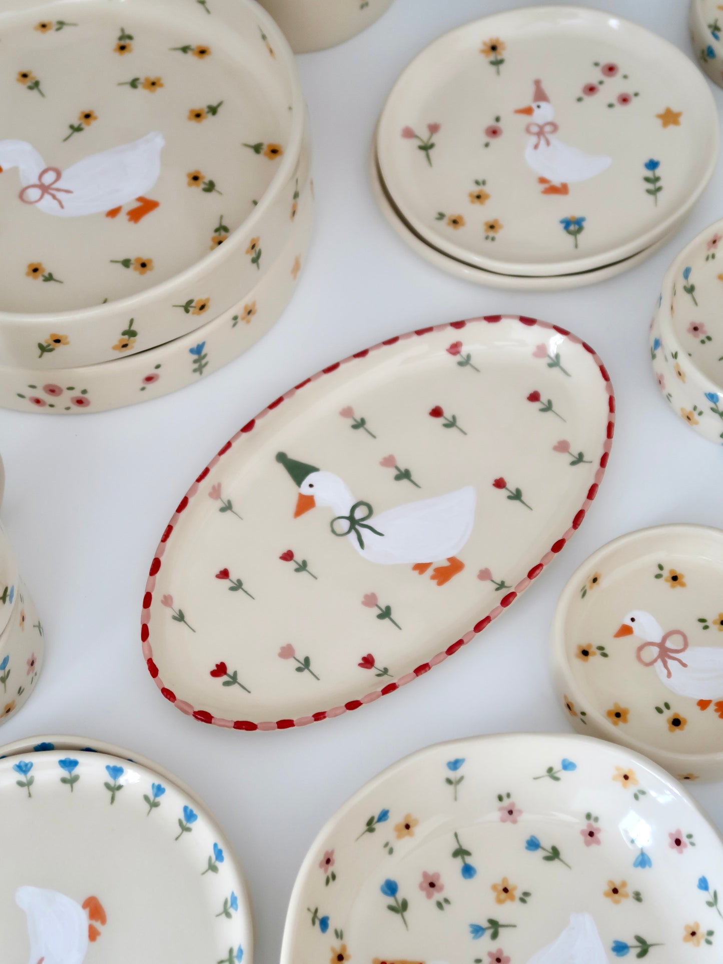 Platter with a duck, red and pink flowers