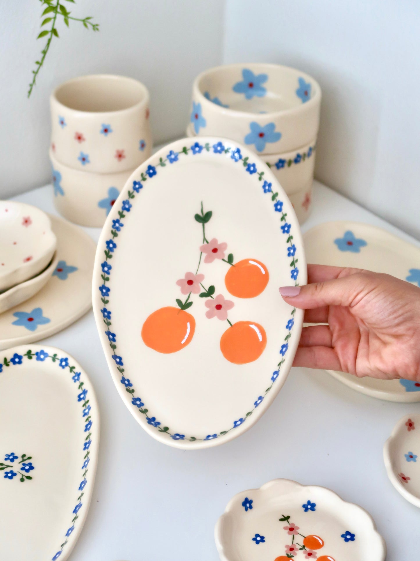 Platter with oranges and blue flowers