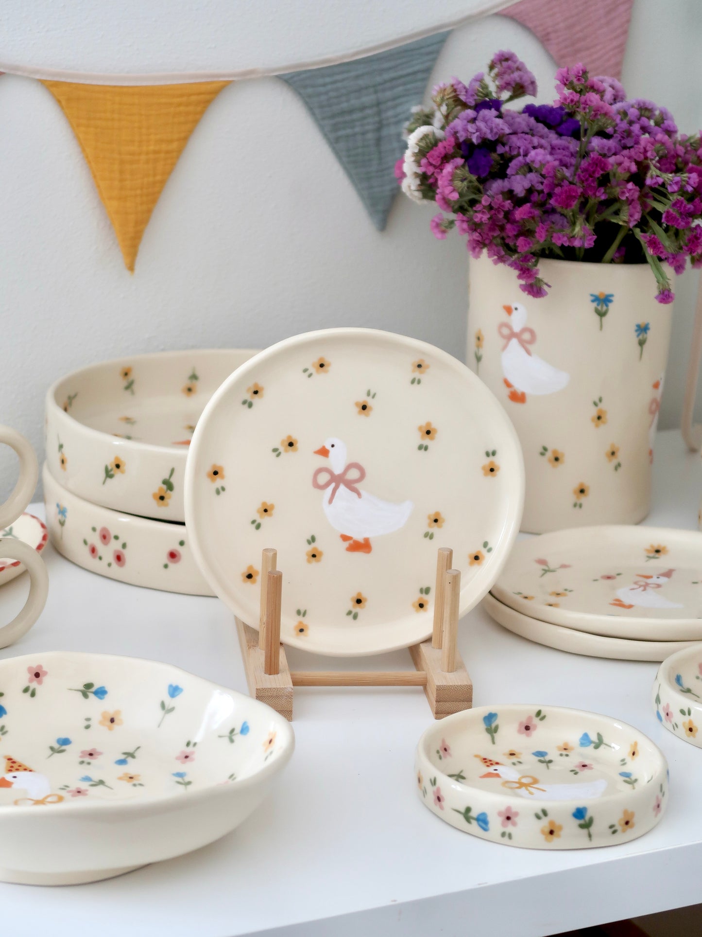 Breakfast/dessert plate with a duck and yellow flowers